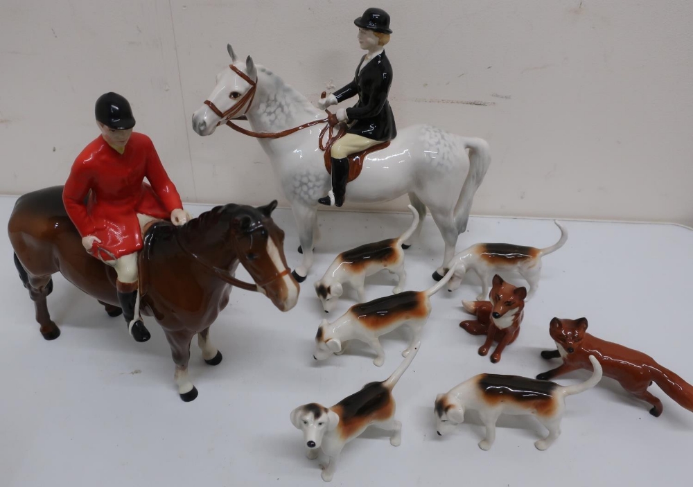 Beswick hunting group, mounted lady and gentlemen, six hounds and two foxes, (10)