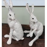 Pair of Raku ware style crackle glazed seated Arctic hares (approx height 47cm)