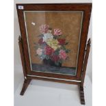 Circa 1930s oak framed fire screen with still life painting to the centre