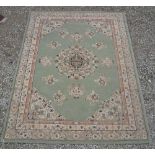 Asmara acrylic green ground rug with floral border (195cm x 140cm)