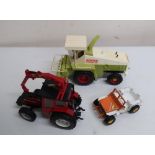Britains die-cast model of a green tractor, flatbed trailer, another tractor, plastic Claas Jaguar