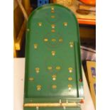 Vintage Chad Valley Bagatelle board, green painted with gilt numerals and steel balls (57cm x 37cm)