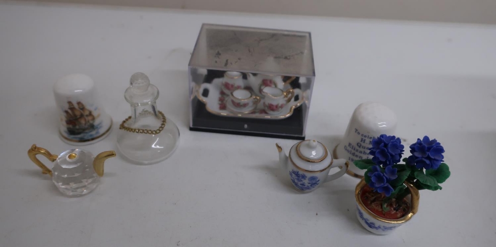 Collection of miniatures and dolls house ceramics including candelabra, table lamps, telephone,