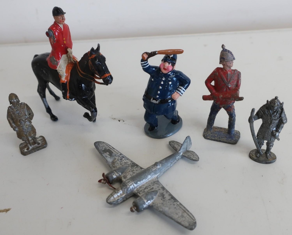 Four Dinky small scale model die-cast aeroplanes, and a quantity of lead and other metal soldiers,