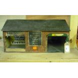 Tinplate garage workshop building, with brick effect and Vauxhall, Shell, Firestone advertising (