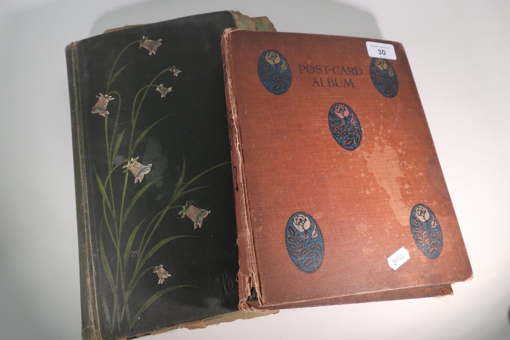 Two postcard albums containing an extremely large quantity of various assorted postcards, mostly