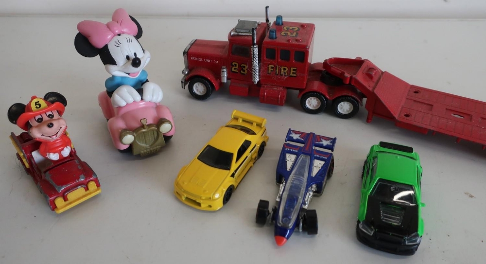 Collection of various scale die-cast toys including tractors, Hot Wheels etc