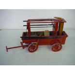 Handmade wooden model of a Victorian fire engine, with spoked wheels (37cm x 22cm)