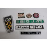 Collection of car badges including Triumph, Austin Morris, British Leyland, Mercedes, AA Members,