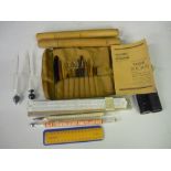 Two dairy thermometers, two hydrometers, slide rule with instructions, scalpel, cut throat razor and