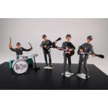 Set of four painted cast metal The Beatles figures (missing drummers stool)