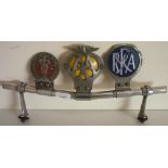 Chrome car badge bar with British Medical Association, AA and another car badge (length 40cm)