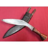 Tempered steel Indian made kukri knife with 12 inch blade, wooden grip with brass mounts and leather