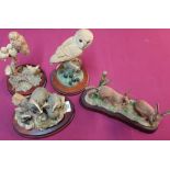 Group of four border fine arts figures including: Evening shadow, badger group, barn owl and