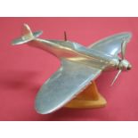 Aluminium scale model of a Spitfire mounted on wooden stand (approx height 9cm)