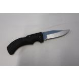 New as boxed folding knife, 3 1/2 inch blade with soft grip handle