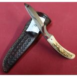 Harry Boden 2.5 inch blade with two piece sambar horned grip and tooled leather belt sheath