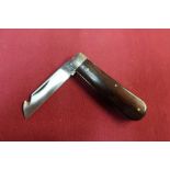 Single bladed gutting type pocket knife by A Wright & Son, Sheffield with two piece wooden grip