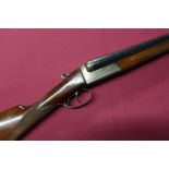 Master 12B side by side shotgun with 28 inch barrels, and 14 1/4 inch straight through stock, serial