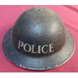 British WWII period steel helmet, complete with liner and chin strap, with blackened top, the