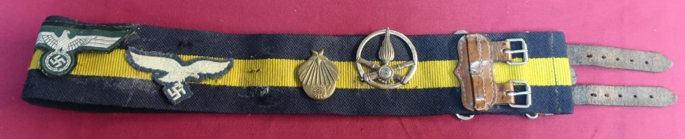 Two stable belts, one with brass buckle, a Russian brass belt buckle and various badges mounted to - Image 5 of 7