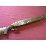 Baikal 12 bore over and under shotgun with 2 3/4 inch chambers, 28 1/2 inch barrels, 14 1/2 inch