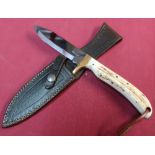 Harry Boden sheath knife with 4 inch blade brass cross piece, complete with tooled leather belt
