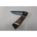 Boxed as new JKR folding knife, wooden slab grip