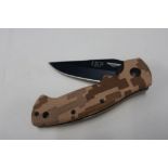 Boxed as new Elk Ridge folding knife, 3 inch black blade with camo handle