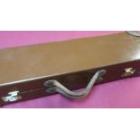 Quality tan leather shotgun motor case with fitted interior and cleaning rods to fit 25 inch barrels