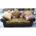 Pair of large brown leather Chesterfield style settees, chenille type seat cushions and loose