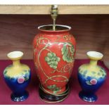 Modern pottery table lamp decorated with fruit and vines, a moon flask, a pair of 1930s vases, a