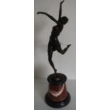 Bronze model of a dancing girl, after Bruno Zach, on circular tapering marble base (height 65 cm)