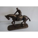 Bronzed model of a race horse with jockey up, after Otupfan oval base (33cm)