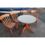 Pine pedestal café table and four chairs