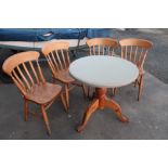 Pine pedestal café table and four chairs