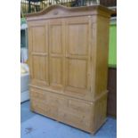 Modern pine wardrobe, arched moulded cornice with central carved floral motif over two paneled