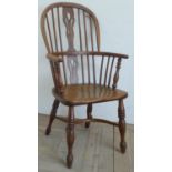 Ash and elm high back Windsor armchair, turned supports joined by a crinoline stretcher