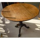 19th C oak tripod table, with circular top on baluster column on three splay legs (diameter 94cm,