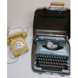 Imperial Good Companion 3 typewriter in metal case, a mustard cased dial telephone, and a 1940s