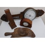 Aneroid barometer and thermometer with silver dials and carved oak case, Edwardian inlaid mahogany