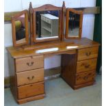 Pine kneehole dressing table with triple mirror (137cm x 43cm x 73cm) and a matching chest of four