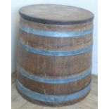 Oak coopered barrel with four alloy bands and planked top (42cm x 48cm)
