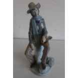 Large Lladro model of a Musician figure seated on a mile post, (H34cm)