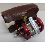 Abu Ambassadeur multiplier 6000 fishing reel, red anodized finish, with instructions, oil,