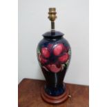 Moorcroft Anemone pattern baluster table lamp, on wooden base, (37cm high max)