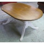 Painted and stained pine dining table, oval top twin pedestal base joined with under stretched and