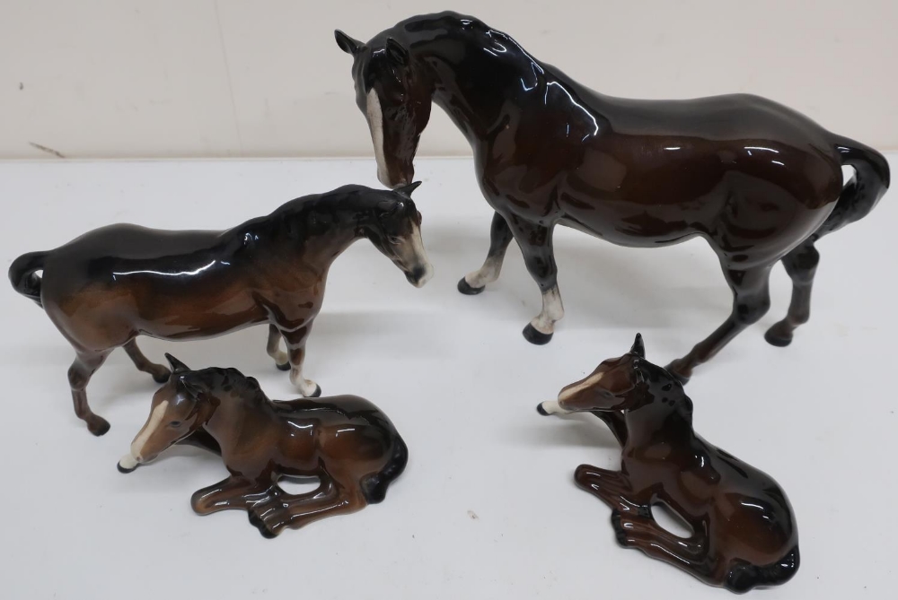 Four Beswick models of horses, two standing, two sitting (4)