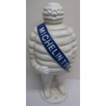 Large white painted cast metal Michelin Man figure, blue sash painted Michelin Tire