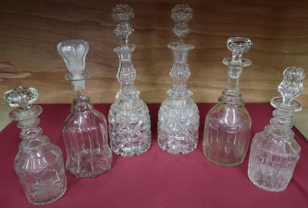 Pair of late Victorian cut glass claret decanters with faceted tops, and four other decanters (6)